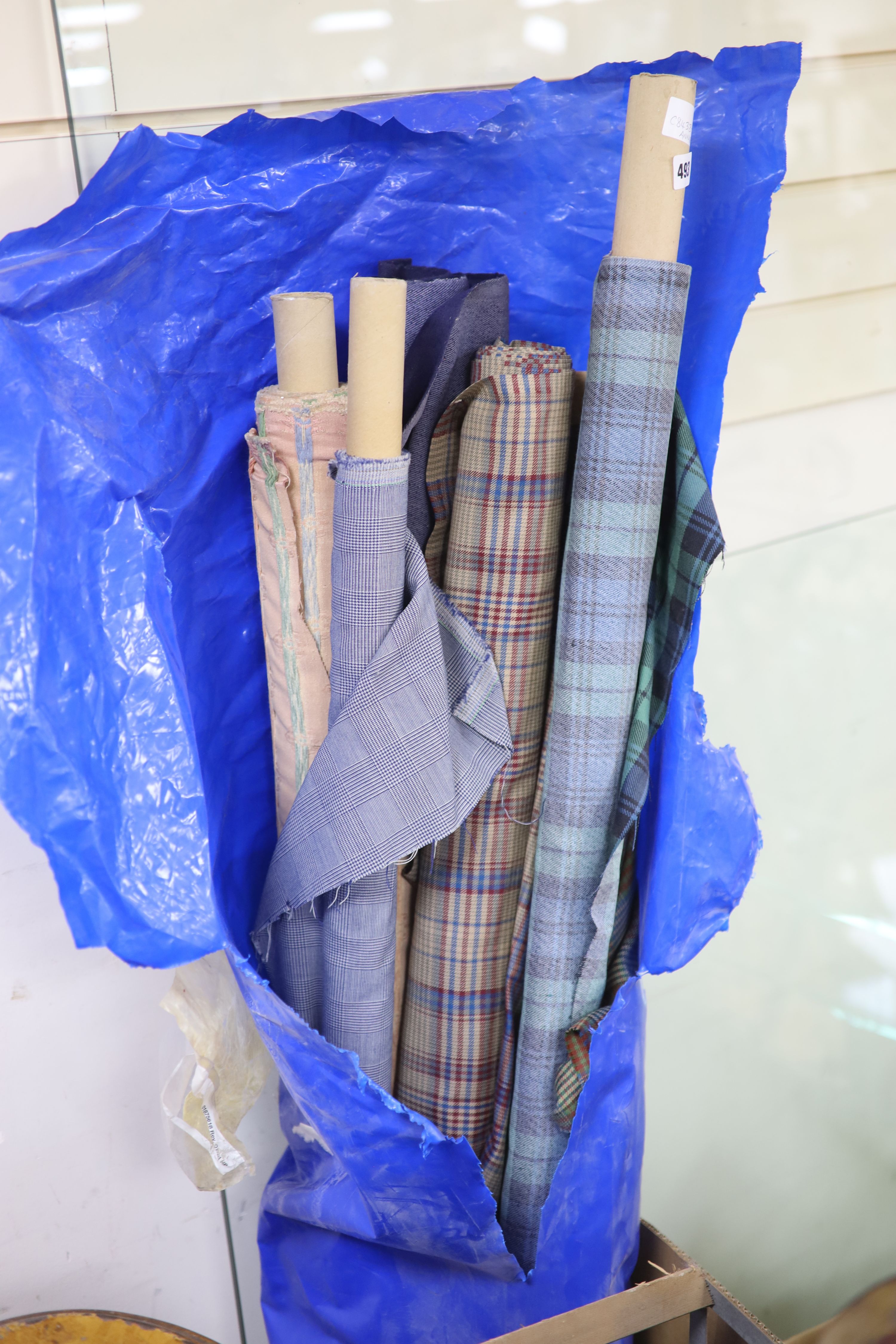 Various lengths of dress fabric including Scottish tartan